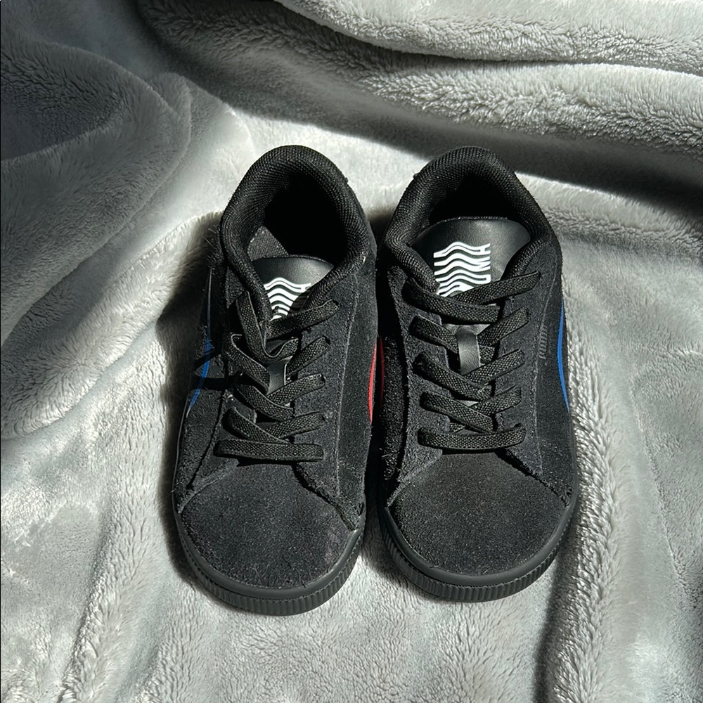 Black Sneakers with Blue and Red Accents